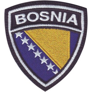 May include: A black embroidered patch with a white border and the word "BOSNIA" in white lettering. The patch features the Bosnian flag, a yellow triangle with white stars on a blue background.
