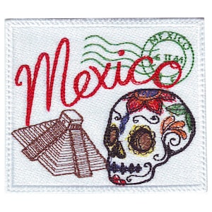 May include: Embroidered patch featuring the word "Mexico" in red, a brown pyramid, and a colourful sugar skull with floral details. The patch has a white background and a white border.