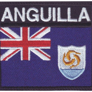 May include: An embroidered patch featuring the flag of Anguilla. The flag is blue with a Union Jack in the upper left corner and the Anguilla coat of arms in the lower right corner. The text "ANGUILLA" is above the flag.