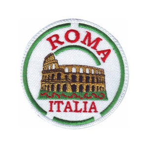 May include: A white, round patch with a green border. The patch features a red embroidered image of the Colosseum in Rome, Italy. The words "ROMA" and "ITALIA" are embroidered in red on the patch.