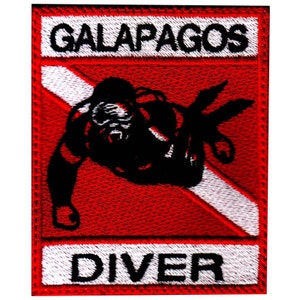 May include: Red and white embroidered patch with a black scuba diver silhouette and the text "GALAPAGOS DIVER".