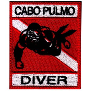 May include: Red and white embroidered patch with a scuba diver silhouette and the text "CABO PULMO DIVER".