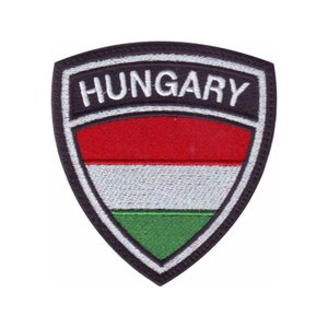 May include: A shield-shaped patch featuring the word "HUNGARY" in white letters on a black background. Below the text are horizontal stripes of red, white, and green, representing the Hungarian flag.