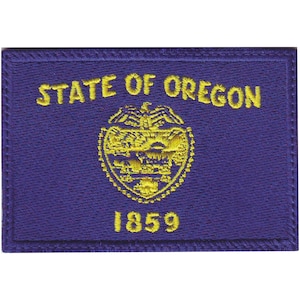 May include: Embroidered patch featuring the State of Oregon seal with the words "STATE OF OREGON" and "1859" in yellow thread on a purple background.