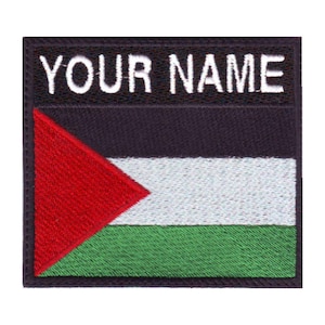 May include: An embroidered patch featuring the Palestinian flag with the text "YOUR NAME" in white lettering on a black background.