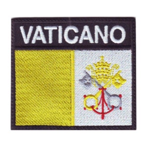 May include: A yellow and white embroidered patch with the word "VATICANO" in white lettering on a black background. The patch features the coat of arms of Vatican City, which includes two keys crossed over a papal tiara.