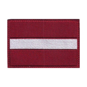 May include: A red embroidered patch with a white stripe in the center, representing the flag of Latvia.