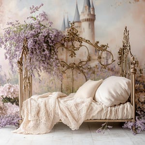 May include: A vintage-style gold metal bed frame with a white crocheted blanket and two white pillows. The bed is set against a backdrop of a painted mural depicting a castle and lavender flowers.