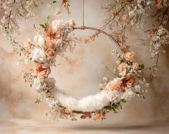 May include: A circular floral arrangement with peach and white flowers, suspended from a brown branch. The arrangement includes a fluffy white surface. The background is a soft, neutral color.