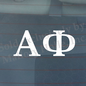 May include: White vinyl decal with the letters "A". and "Φ" representing the Greek letters Alpha and Phi.