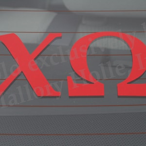 May include: Red vinyl decal with the letters "XO" in a bold, serif font. The letters are cut out and mounted on a clear background.