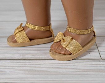 Sandalias con lazo dorado brillante para muñecas de 18 pulgadas