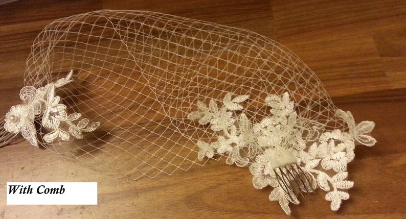 white or Ivory bridal veil with a floral lace motif