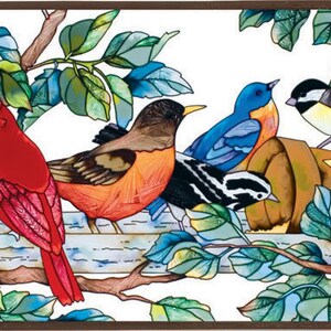 May include: A stained glass window panel featuring a colorful scene of birds perched on a branch. The birds are a cardinal, a robin, a bluebird, a yellow bird, and a black and white bird. The background is a white sky with green leaves.