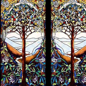 May include: Stained glass window panel featuring two trees with brown trunks and branches, laden with red and yellow fruit. The trees are set against a backdrop of mountains and a sky of white and blue. The design includes floral and leaf patterns in shades of blue, green, and white.