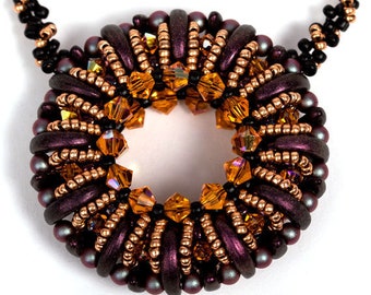 May include: A close-up of a dark purple and copper beaded necklace with a circular pendant. The pendant is made of small beads and crystals in shades of orange and brown.