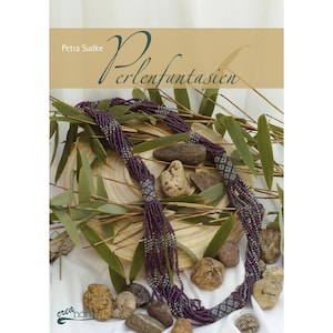 May include: A book titled "Perlenfantasien" by Petra Sudke, featuring a close-up of a purple and blue beaded necklace on a wooden surface with green leaves and stones.