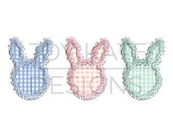 May include: Three embroidered bunny heads with gingham patterns. The bunny heads are blue, pink, and green.