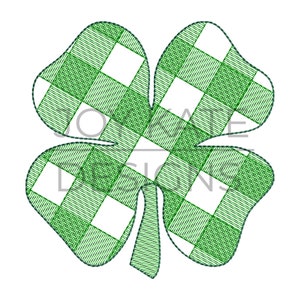 May include: A green four-leaf clover with a checkered pattern. The clover is outlined in dark green.
