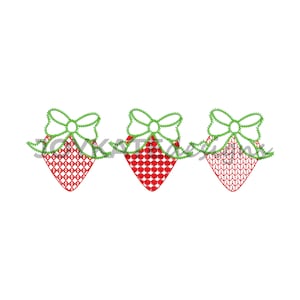 May include: Three red and white strawberry designs with green bows. Each strawberry has a different pattern.