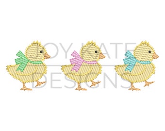 May include: Three yellow chicks with bows around their necks. The chicks are facing right and have green, pink, and blue bows.