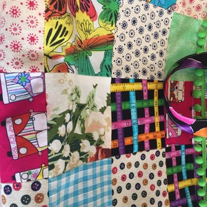 May include: A patchwork fabric bag with a variety of colorful patterns, including butterflies, flowers, and a skull. The bag has a black and white ruler pattern on one side and a green and black striped pattern on the other side.