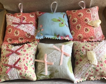 Six rose scented wardrobe and drawer fragrance sachets, in gift box.