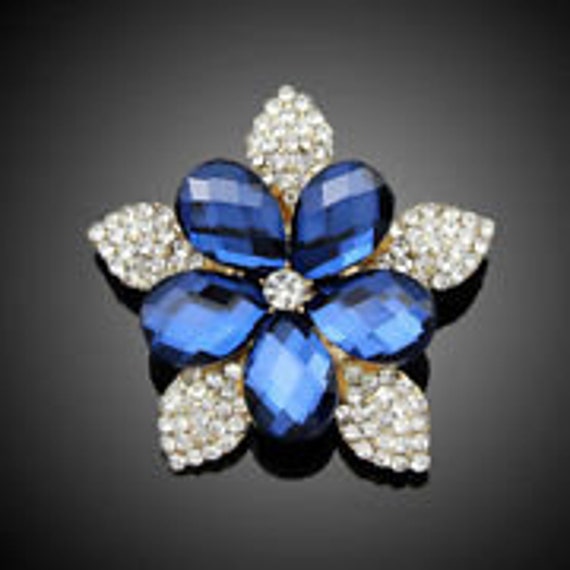 small blue brooch