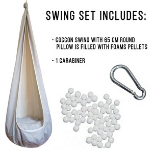 May include: A grey hanging swing chair with a white inner lining and a grey pillow filled with white foam pellets. The swing set includes a carabiner and a pile of white foam pellets.