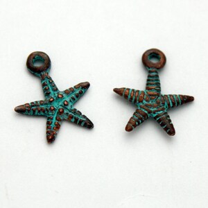 May include: Two turquoise and copper colored starfish charms with a loop at the top for attaching to jewelry or crafts.