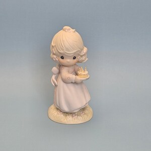 girl holding a birthday cake, Porcelain Figurine