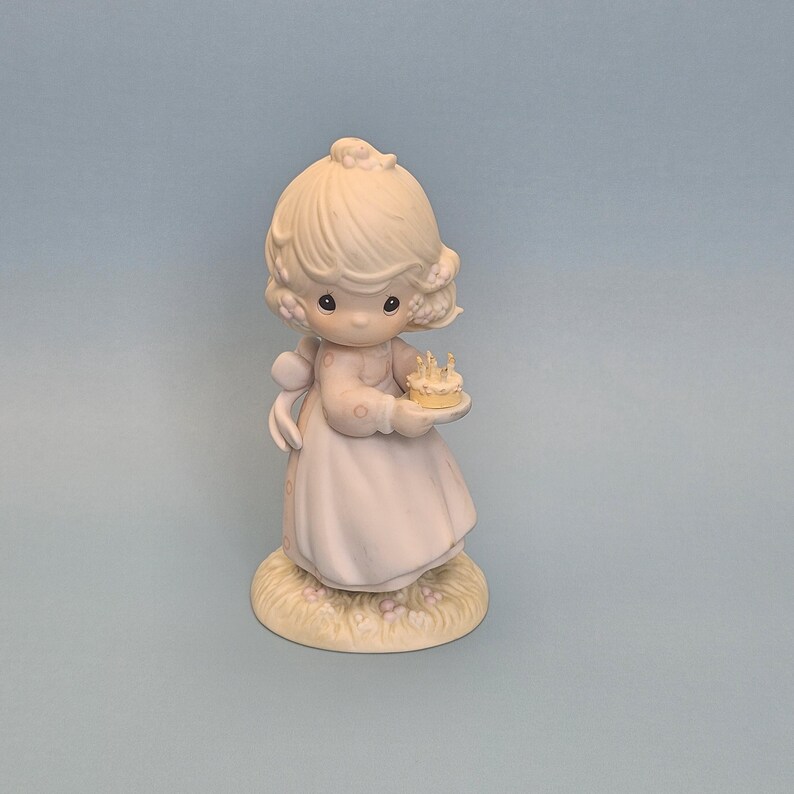 girl holding a birthday cake, Porcelain Figurine