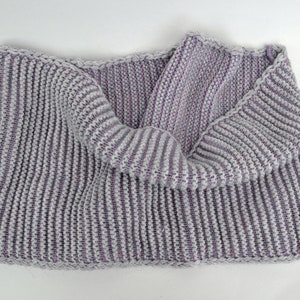 May include: A gray and purple striped knitted scarf with a ribbed texture.