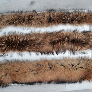 May include: Three brown fur strips of different lengths labeled L, XL, and XXL. The fur is soft and fluffy, and the strips are laid out on a white surface.