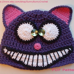 May include: Purple crochet cat hat with white eyes, black teeth, and pink nose.  PDF Pattern.