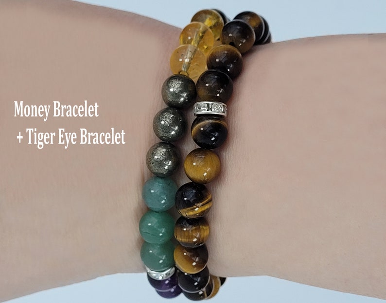 May include: Two beaded bracelets, one with pyrite and green beads, the other with tiger eye beads. The bracelets are adorned with silver-colored spacers. Text on the image reads "Money Bracelet + Tiger Eye Bracelet."