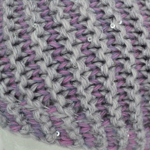 May include: Gray and pink knit beanie with silver sequins.
