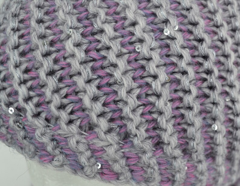 May include: Gray and pink knit beanie with silver sequins.