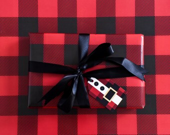 Red gingham Christmas wrapping paper sheet and Santa gift tag