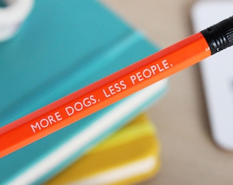 More dogs less people embossed pencil