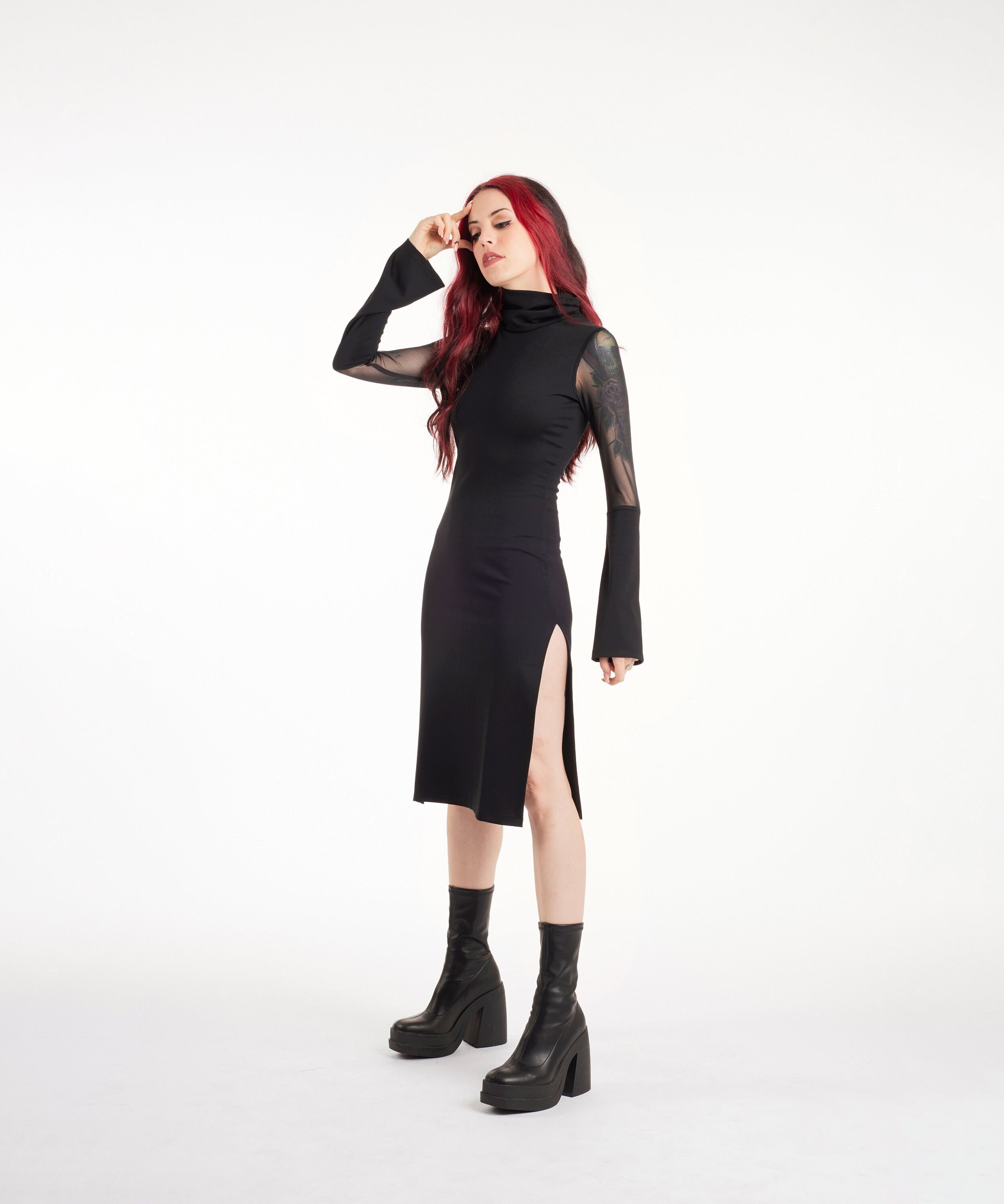 red midi dress worn with black turtleneck and accessories