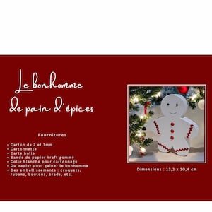 May include: A white gingerbread man cutout with red buttons and a red candy cane. The gingerbread man is on a red background with a Christmas tree and lights in the background. The text 'Le bonhomme de pain d'épices' is in the top left corner of the image. The text 'Fournitures' is below the title. The text 'Dimensions: 13,2 x 10,4 cm' is in the bottom right corner of the image. The text below 'Fournitures' lists the materials needed to make the gingerbread man.