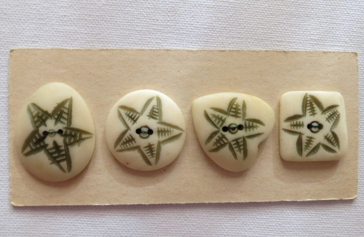 4 buttons 1\u201d Star starfish imprint multiple shapes cream ivory color