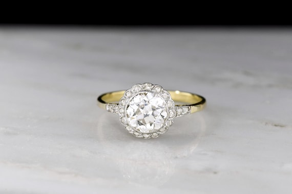 Gilded Age Two-Toned Cluster Ring with a Floral-Patterned Transitional Cut Diamond Center