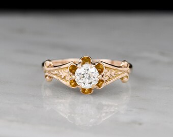 Antique Victorian (c. Late 1800s - Early 1900s) Solitaire Buttercup Engagement Ring with Mermaid-Tail Shoulders