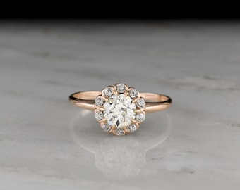 Antik, vintage, förlovningsring: Damring med 75 karat diamanter i kluster/halo-modell, urval av ädelstenar, från tidigt 1900-tal.