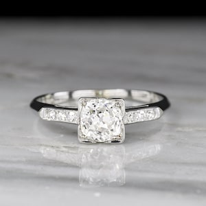 Classic c. 1950s Midcentury Platinum Engagement Ring with a GIA Old Mine Cut Diamond Center