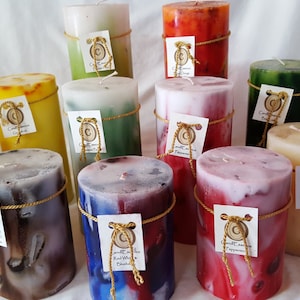 Extremely long burning scented pillar candles. Hand-poured, quality, elegant, vibrantly colored.