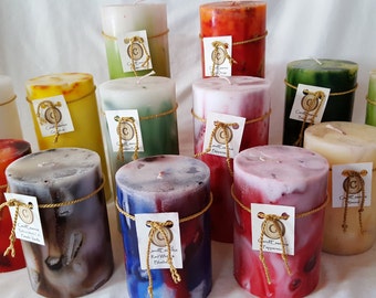 Extremely long burning scented pillar candles. Hand-poured, quality, elegant, vibrantly colored.