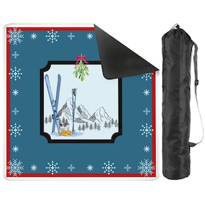 May include: A blue and white winter-themed mat with a black border, red trim, and snowflake accents. The center features a ski scene with skis, poles, and mountains. Includes a black carrying bag.